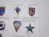 a lot of badges that are on a piece of paper
