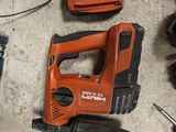 a cordless drill and a cordless hammer on the floor