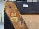 a piece of wood that has a tag on it