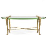 a gold and green glass coffee table with gold legs
