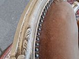 a close up of a person ' s legs on a chair