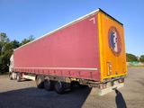 a semi truck that is parked in a parking lot