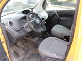 a small yellow car with a steering wheel and a dashboard