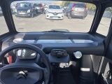 a view of a car from the driver ' s seat of a vehicle