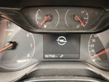 a close up of a car dashboard with various gauges