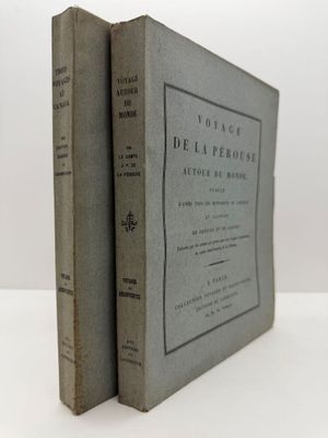 two books sitting on top of each other on a white surface