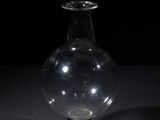 a glass vase that is sitting on a table