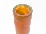 a glass with a liquid inside of it sitting on a table
