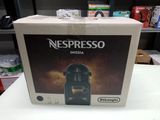 a box of nespresso coffee machine on a table