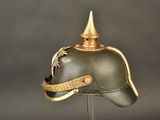 a helmet on a stand on a gray background