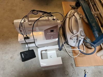 an image of a sewing machine sitting on top of a cardboard box