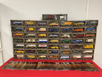 a red table with a bunch of toy trains on it