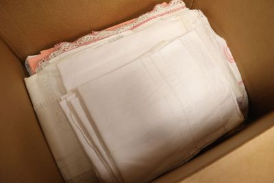 a cardboard box with a lot of papers inside of it