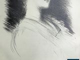 portrait of a woman in profile with her head turned to the left