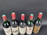 six bottles of wine are lined up in a row