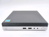 a close up of a small computer on a white surface