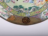 a plate that has a painting on it on it