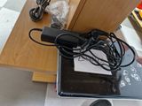 a laptop computer sitting on top of a wooden desk
