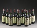 six bottles of wine are lined up in a row on a table