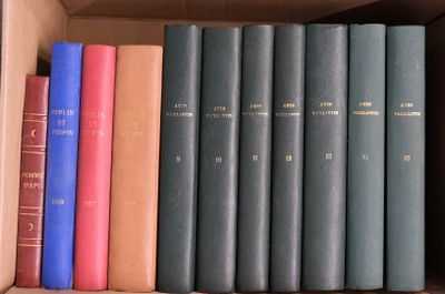 many books that are in a box on the shelf