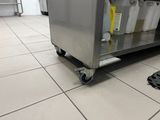 a large metal cabinet with a bunch of containers on it
