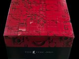 a red box with writing on it sitting on a table