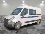 a white van that is parked on a checkered floor