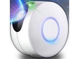 a close up of a small white object with a blue light on it