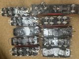 a lot of different types of train engines on the ground