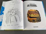 a picture of a book with a picture of a cat on it