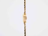 an image of a gold watch with diamonds on a chain