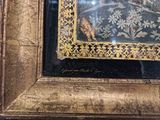 a picture of a picture of a giraffe in a gold frame
