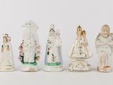 seven figurines of different sizes and colors
