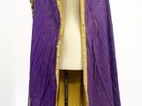 an image of a purple and gold cape on a mannequin