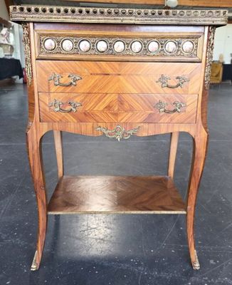 a small wooden table with a drawer on top of it