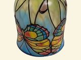 a vase that has a colorful design on it