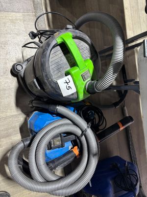 a picture of a room with a vacuum and a dryer