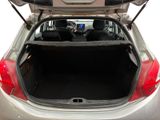 the back of a car with its trunk open and a tv in the trunk