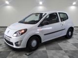 a picture of a small white car on a checkered floor