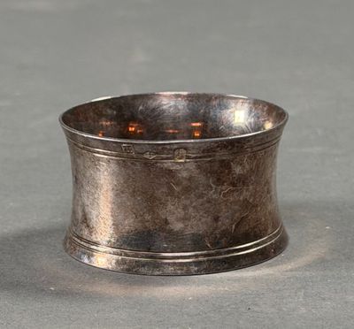 a silver cup that is sitting on a table