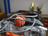 an orange ball sitting on top of a black box