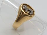 an image of a gold and diamond ring on a clear glass