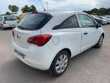 a white car parked in a parking lot with other cars