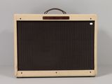 a close up of a brown and black amplifier on a white surface