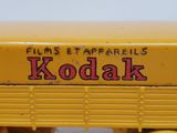 a close up of a yellow toy truck with a sign on it