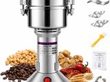 a close up of a blender on a white background with coffee beans