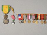a row of medals and medals hanging on a wall