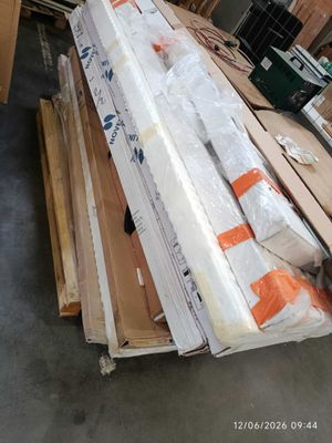 a large pile of wood in the middle of a room