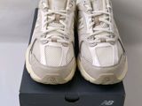 a pair of new balance shoes in a box on a table