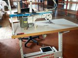 a sewing machine sitting on a table in a room